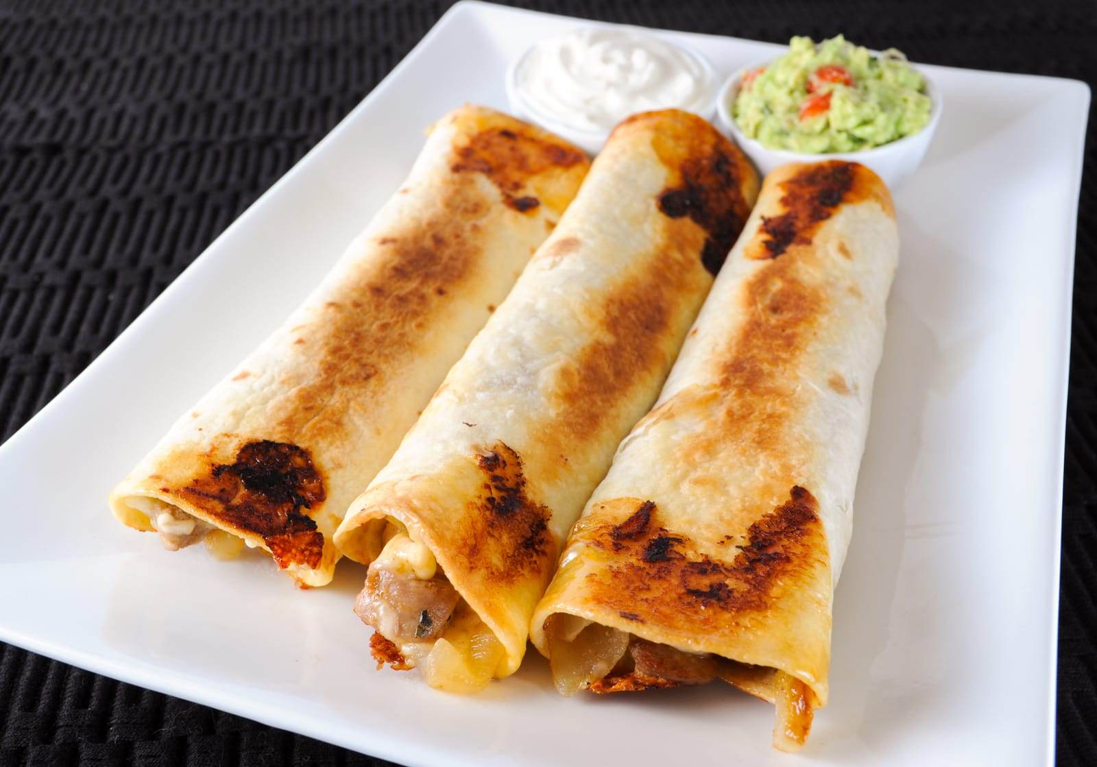 Pork Tenderloin, Caramelized Onion, and Monterey Jack Baked Flautas