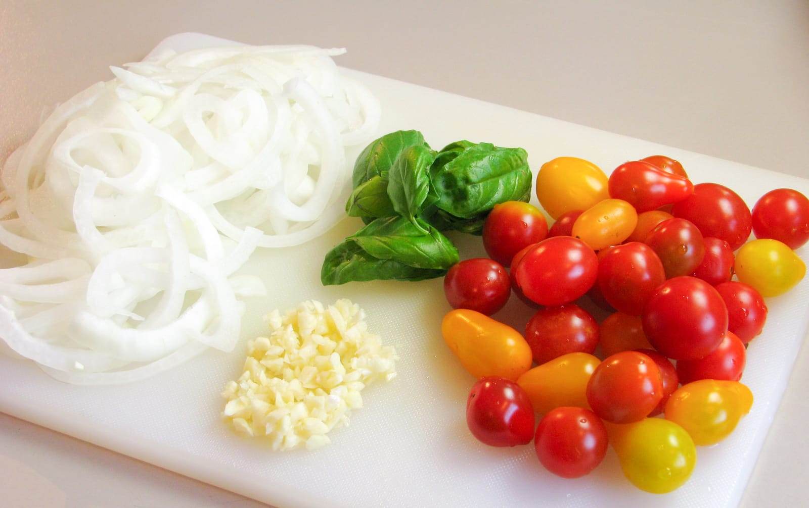 Pork Chops with Tomatoes, Caramelized Onions, and Feta Cheese