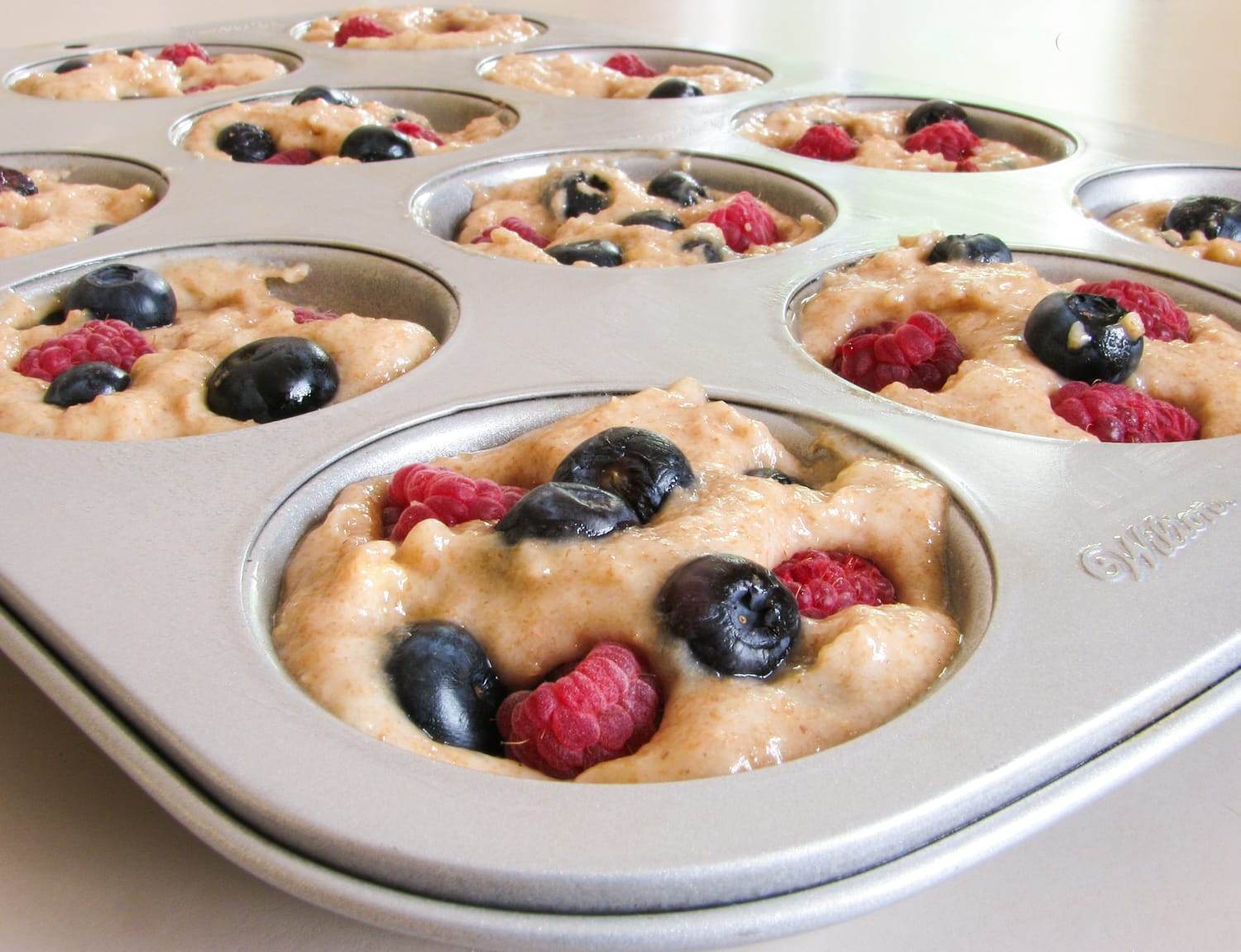 Banana, Blueberry and Raspberry Muffins