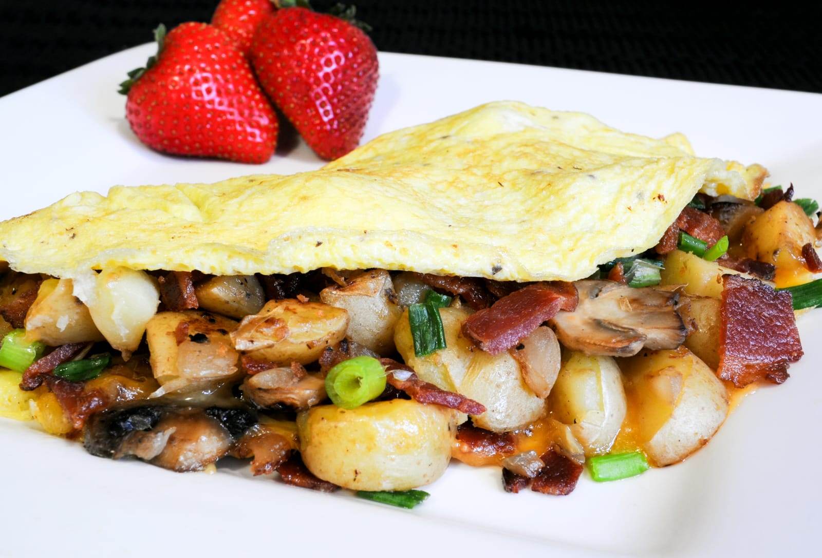 Peasant Omelet with Potatoes, Mushrooms, Bacon, and Cheddar