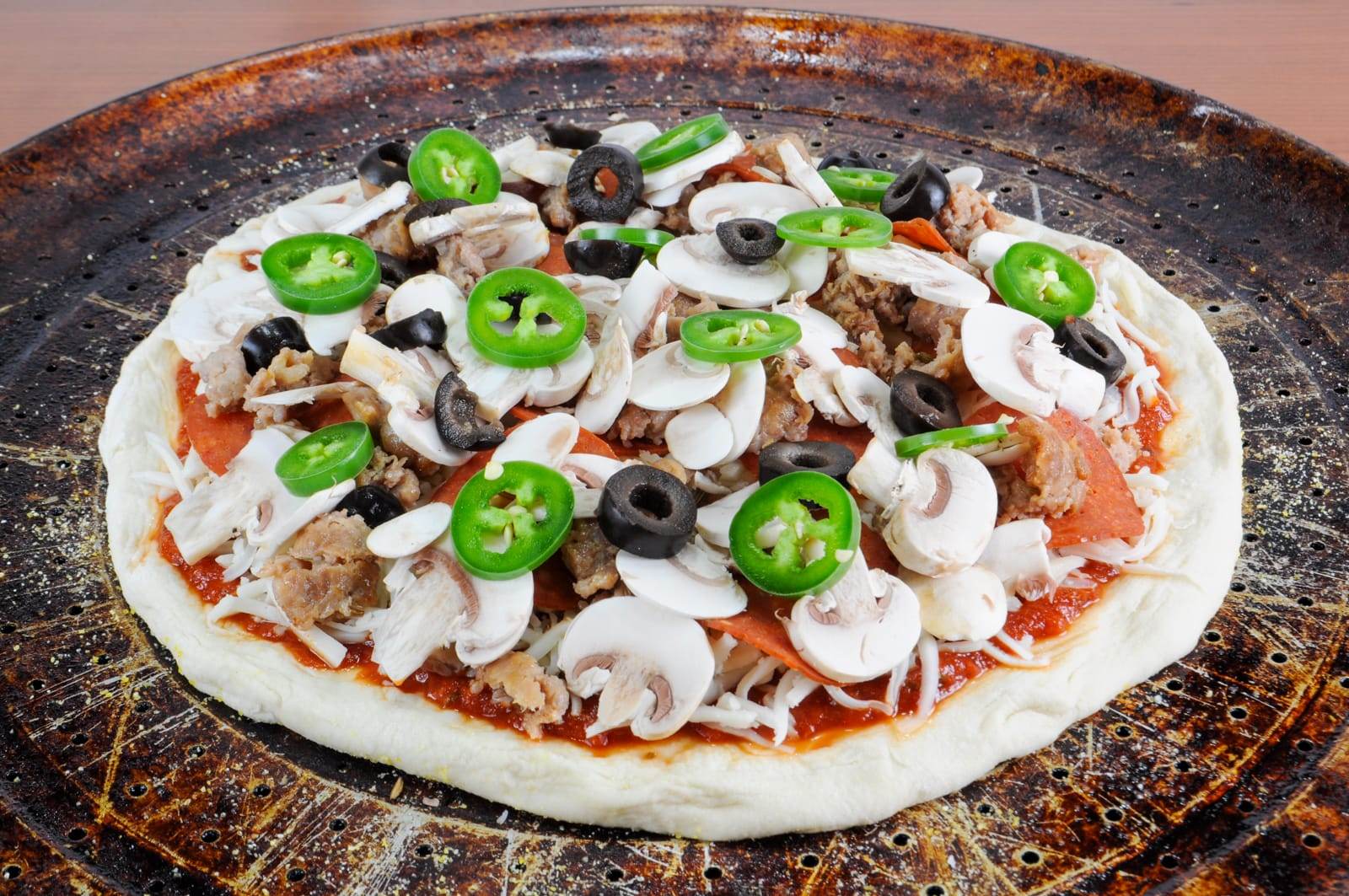 Turkey Italian Sausage, Pepperoni, Mushroom, Olive, and Jalapeno Pizza