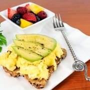 Fluffy Scrambled Eggs and Avocado Slices on Toast