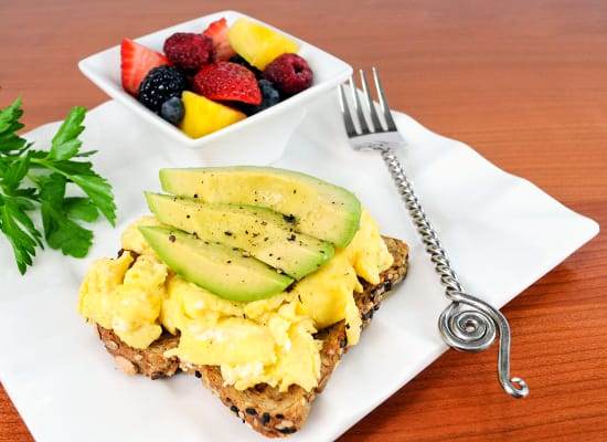 Fluffy Scrambled Eggs and Avocado Slices on Toast