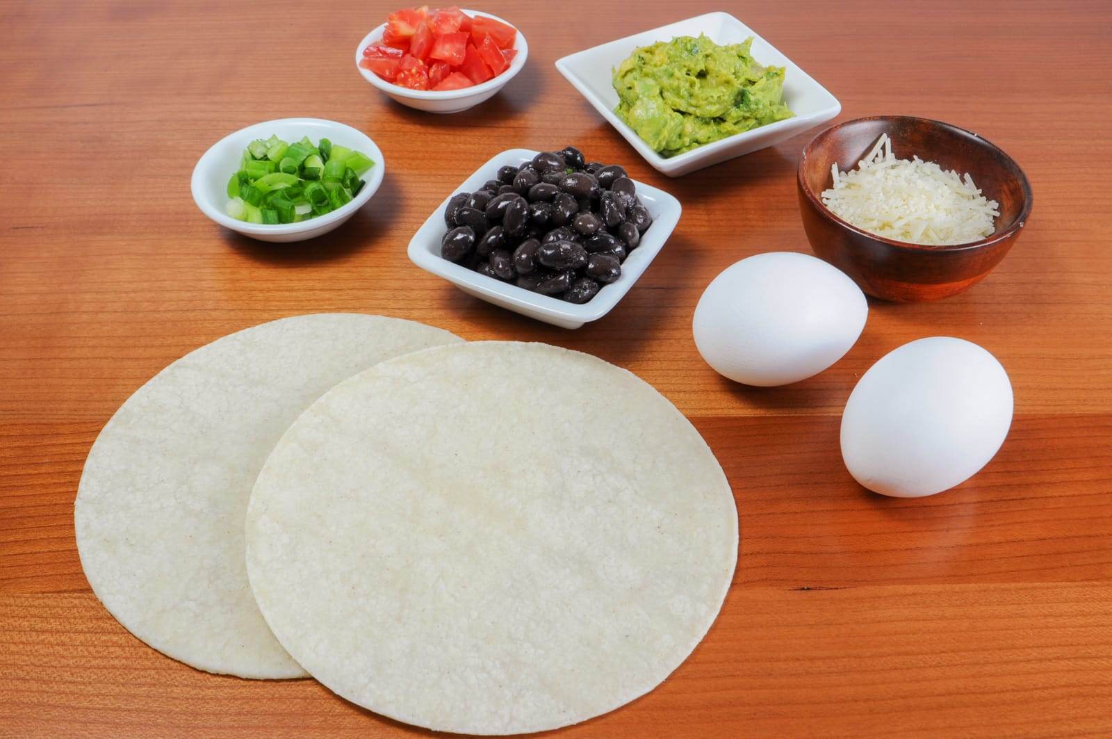 Breakfast Tostada with Guacamole, Black Beans, and Poached Egg