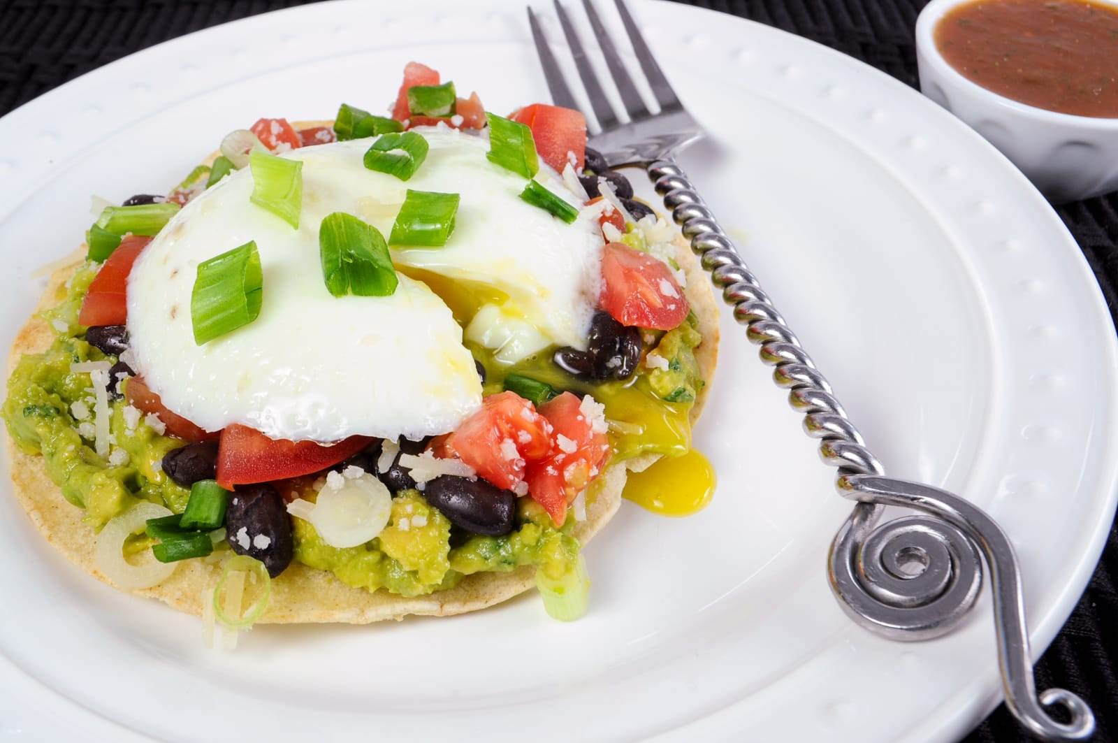 Breakfast Tostada with Guacamole, Black Beans, and Poached Egg