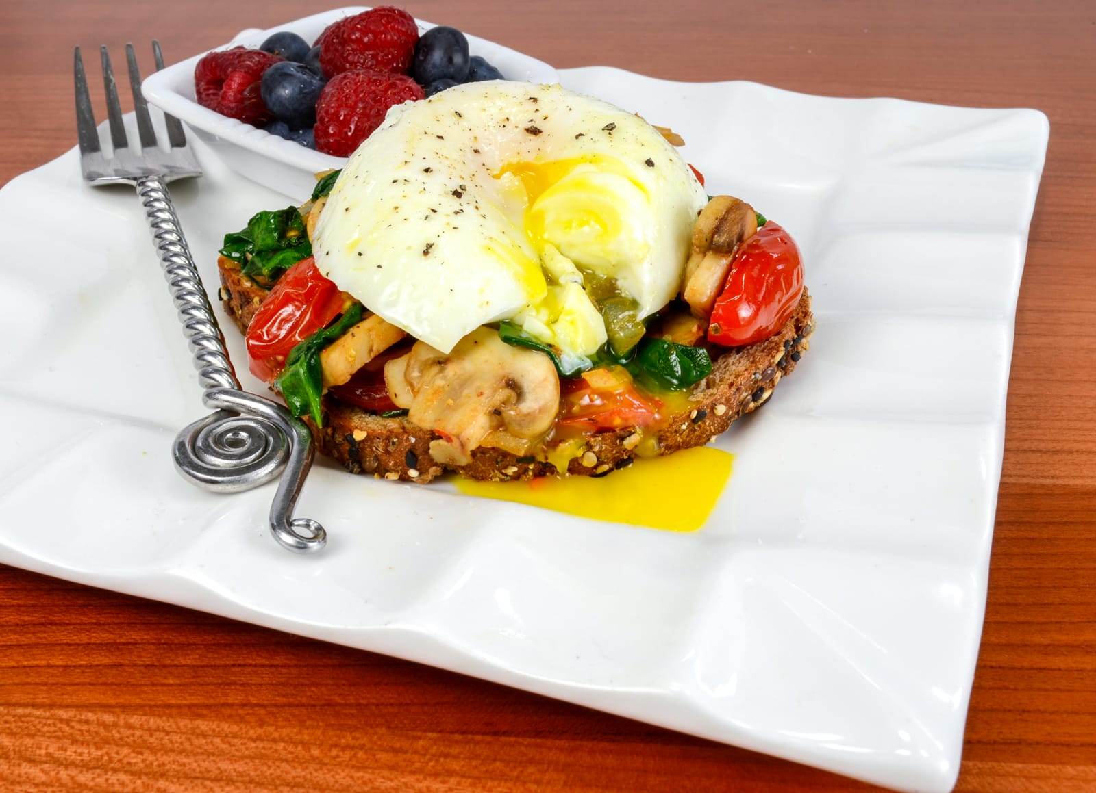 Poached Egg on Toast with Sautéed Mushrooms, Tomatoes, and Spinach