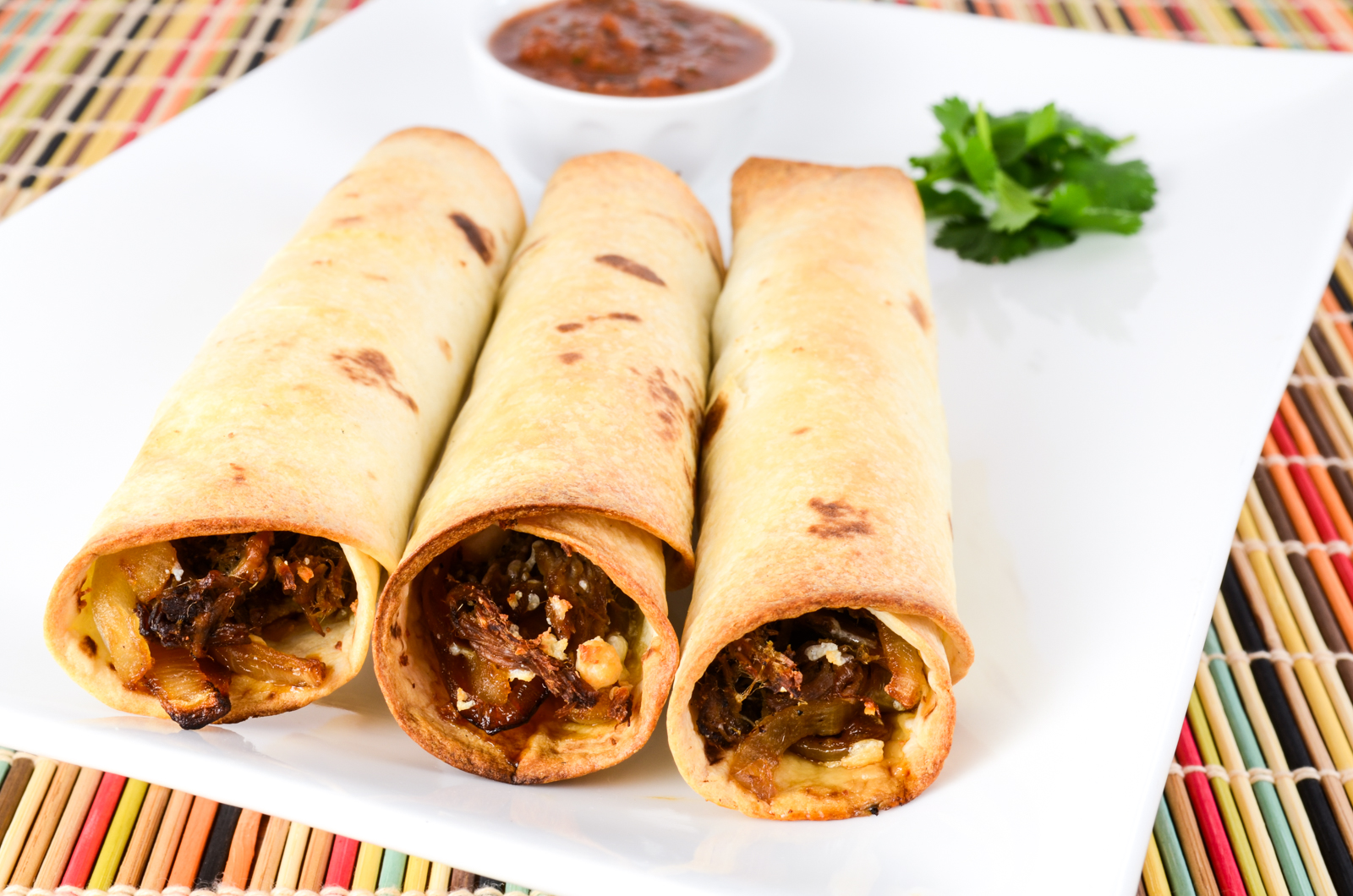 Shredded Beef, Caramelized Onion, and Cotija Cheese Baked Flautas-image