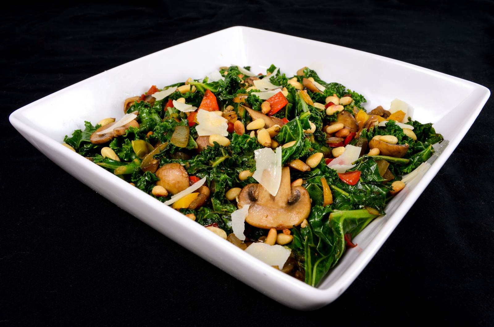 Warm Balsamic Kale, Mushroom, and Pepper Salad with Toasted Pine Nuts