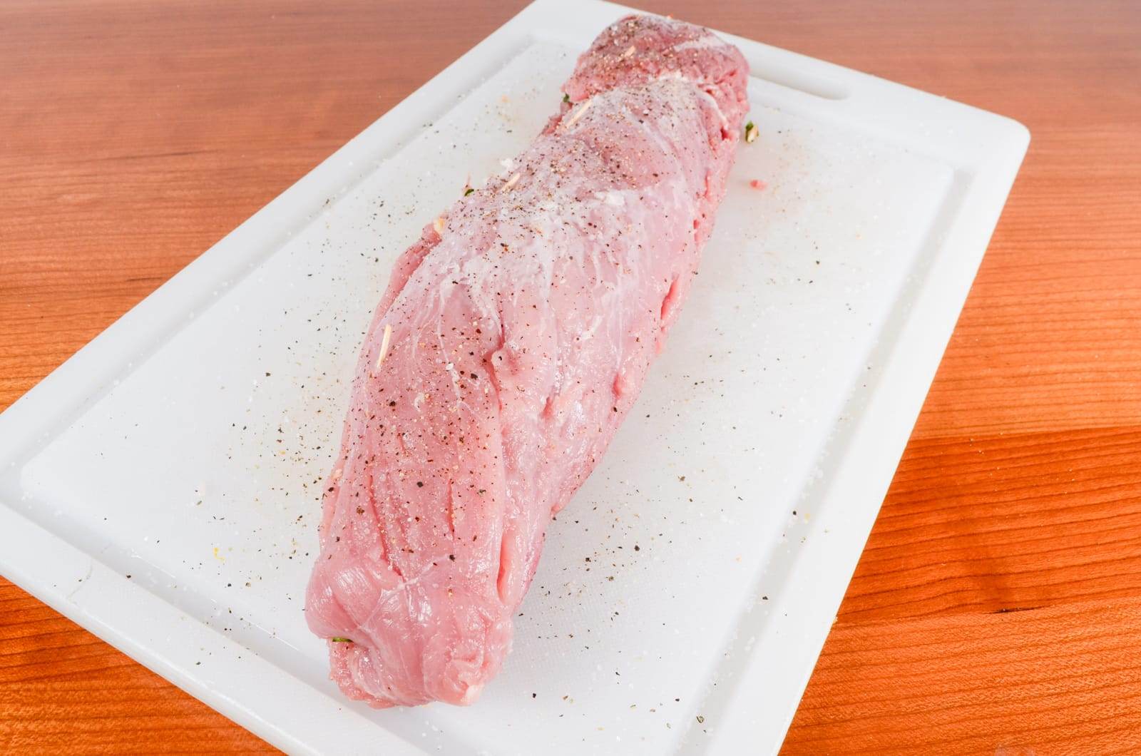 Pork Tenderloin Stuffed with Spinach, Roasted Bell Pepper, Mushroom, and Parmesan