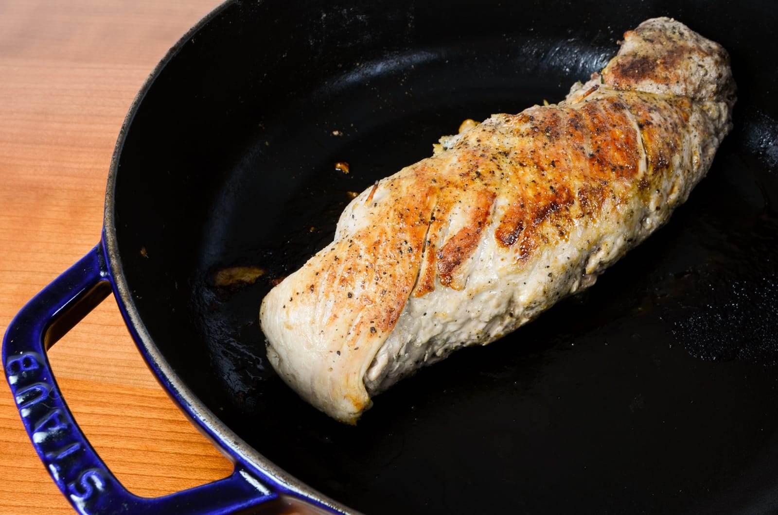 Pork Tenderloin Stuffed with Spinach, Roasted Bell Pepper, Mushroom, and Parmesan