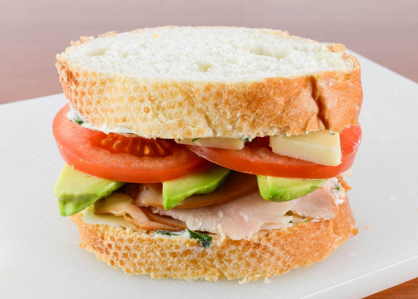 Turkey, Extra Sharp Cheddar, Tomato, and Avocado Panini with Basil Mayonnaise