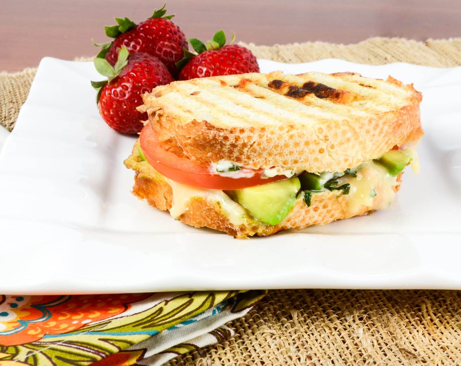 Turkey, Extra Sharp Cheddar, Tomato, and Avocado Panini with Basil Mayonnaise