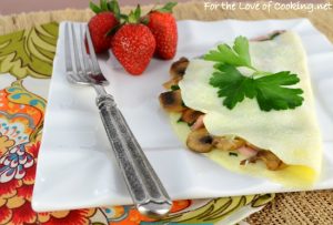 Thin Omelet with Sautéed Mushrooms, Ham, Spinach, and Extra Sharp Cheddar