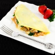 Thin Omelet with Caramelized Onions, Sautéed Mushrooms, Ham, Spinach, and Brie