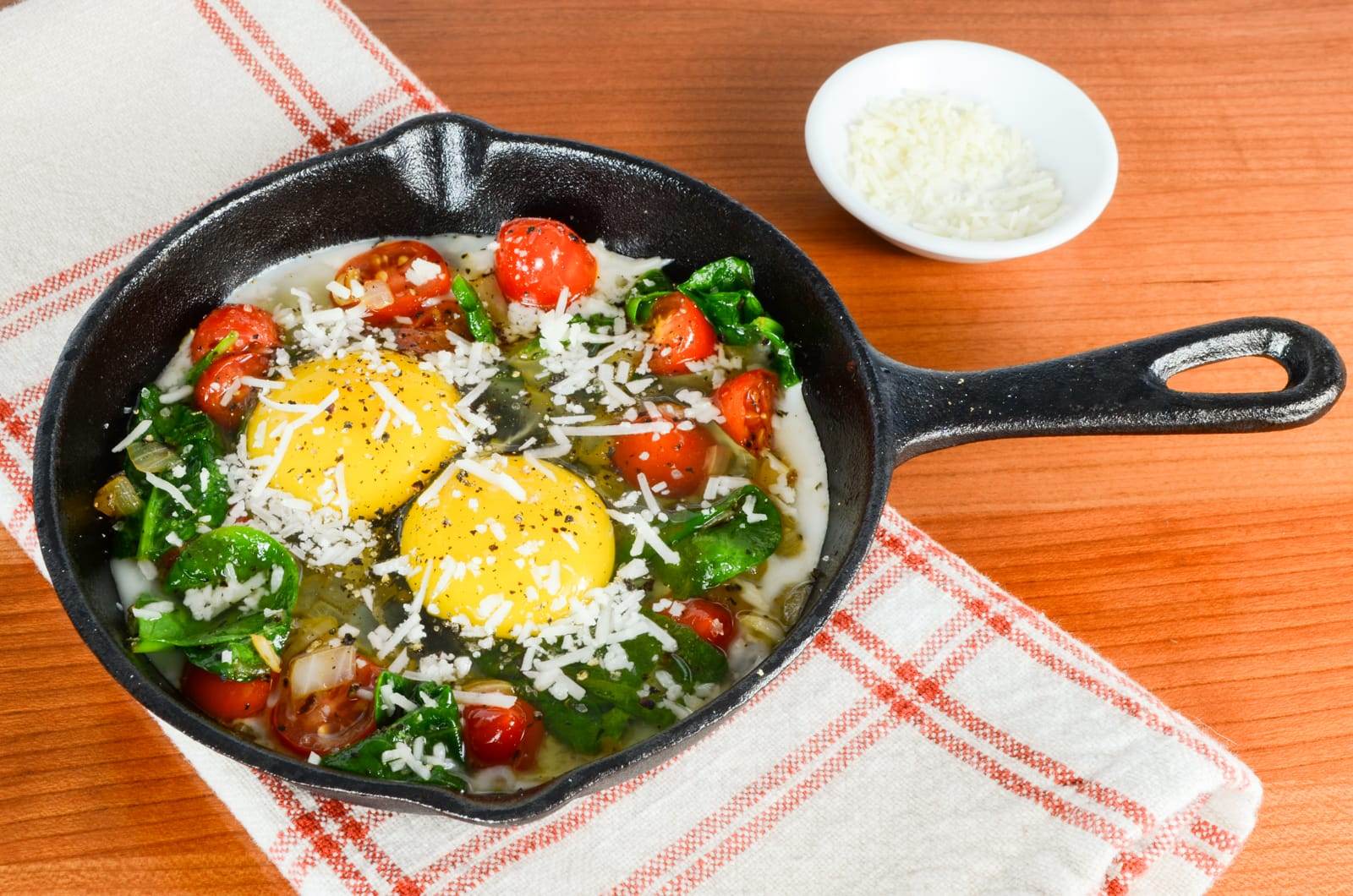 Baked Eggs with Sautéed Onions, Tomatoes, and Spinach