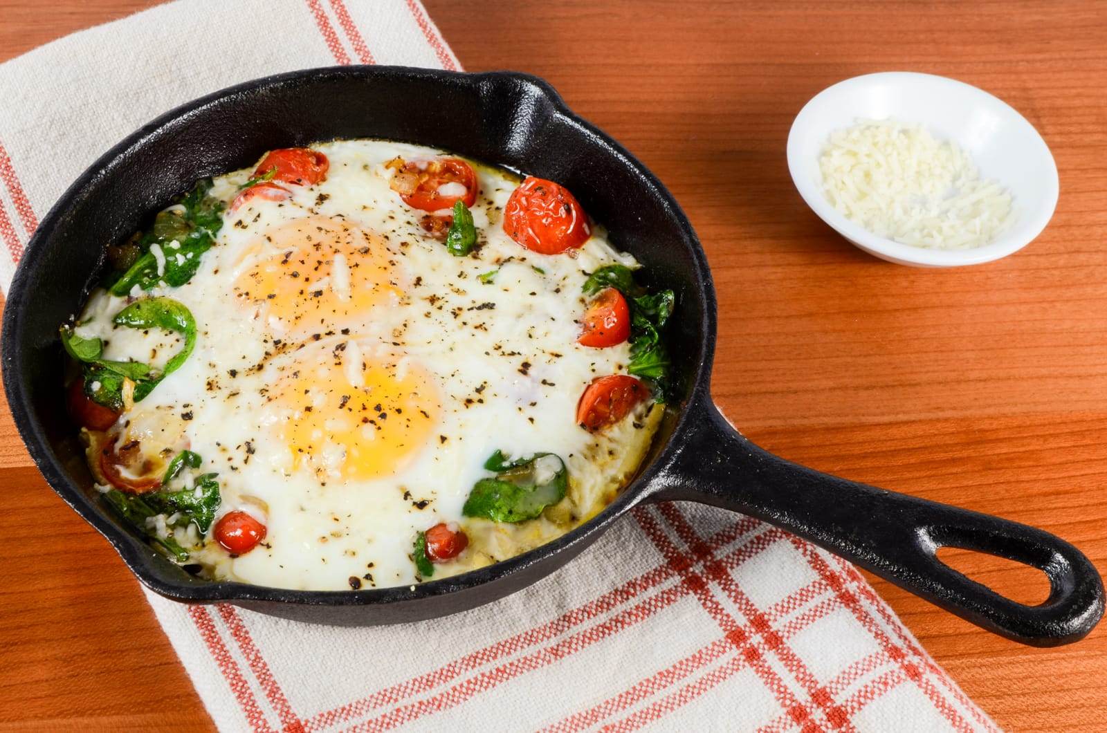 Baked Eggs with Sautéed Onions, Tomatoes, and Spinach