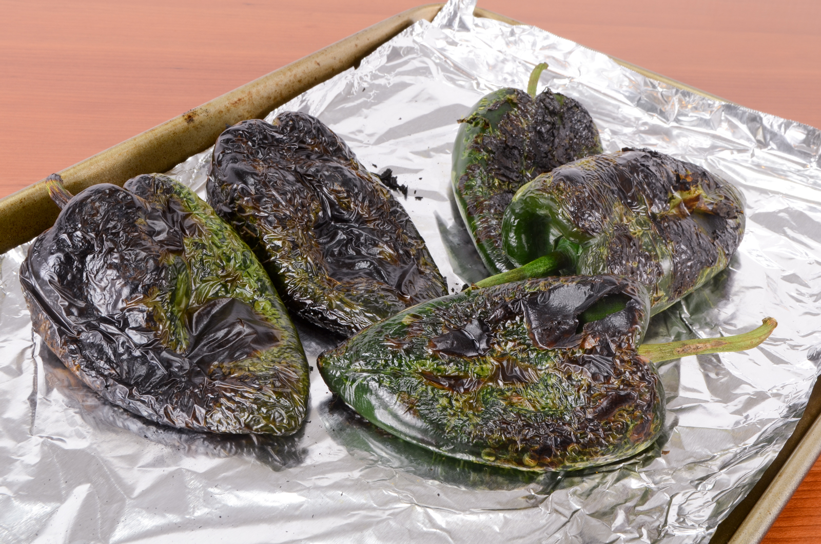 Cheesy Roasted Poblano Peppers with Homemade Refried Beans and Enchilada Sauce