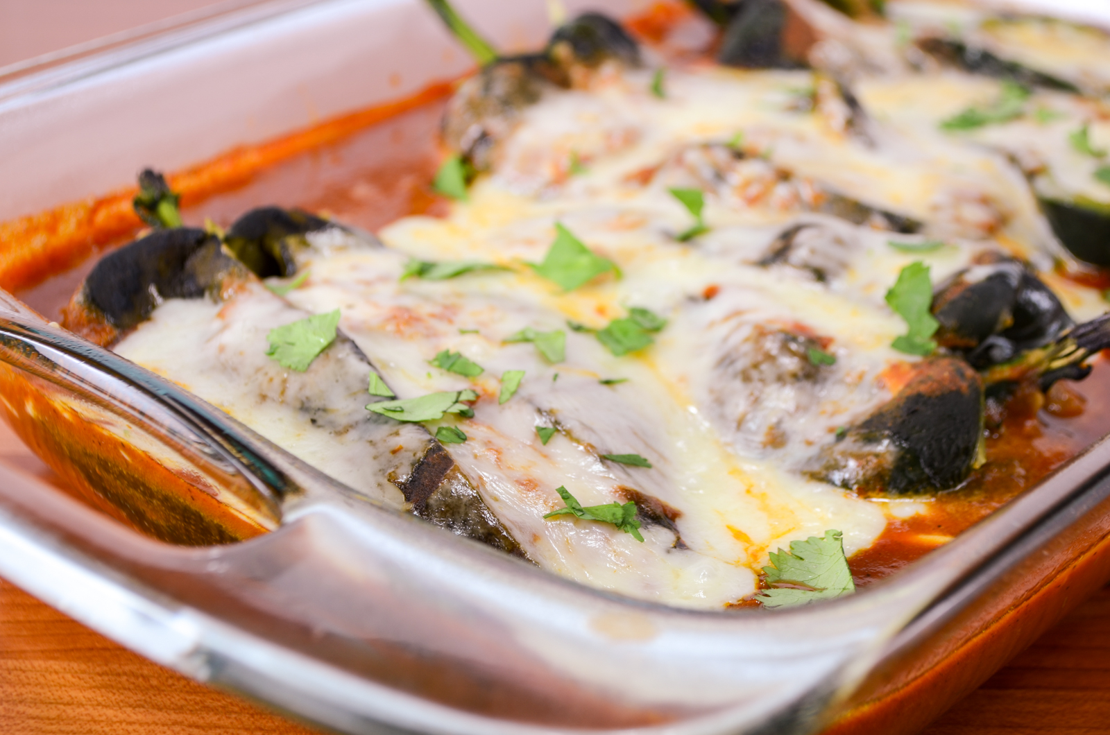 Cheesy Roasted Poblano Peppers with Homemade Refried Beans and Enchilada Sauce