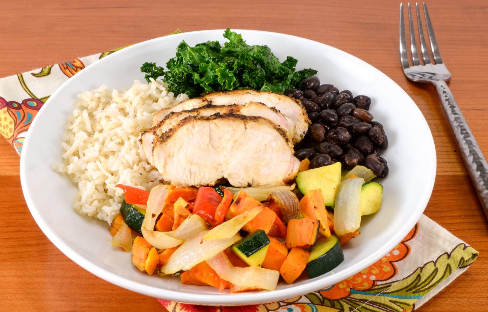 Rice Bowl with Spicy Chicken, Roasted Sweet Potatoes & Vegetables, Black Beans, and Kale