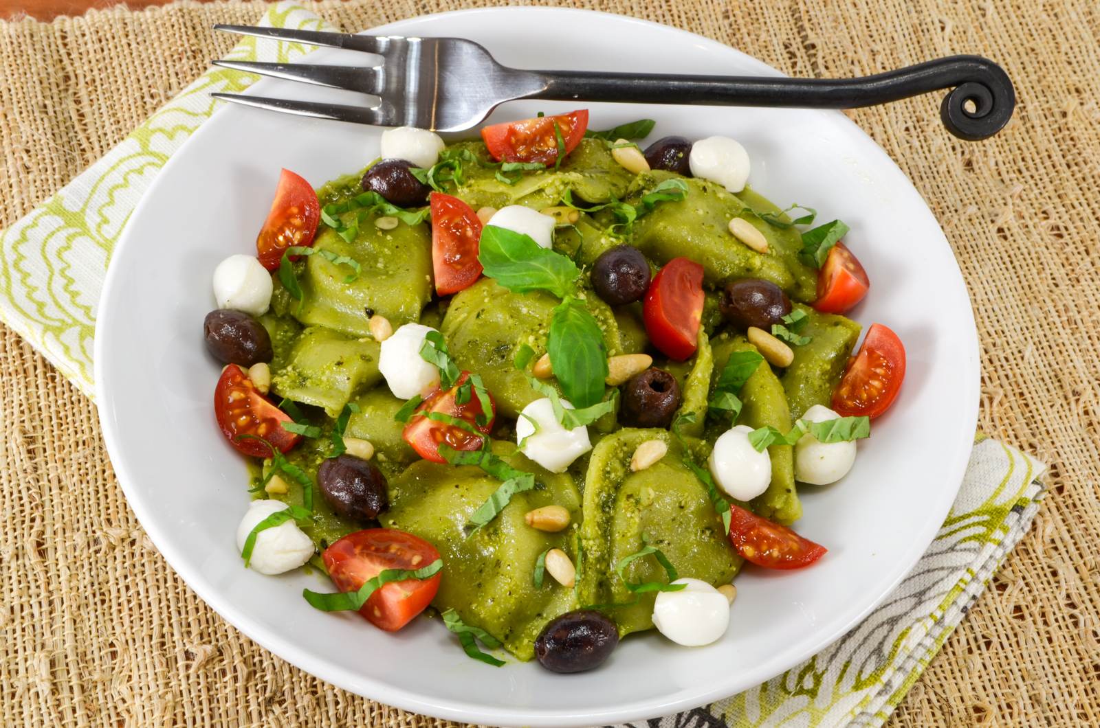 Spinach and Kale Ravioli Pasta Salad with Fresh Tomatoes, Basil, Mozzarella, and Taggiasca Olives