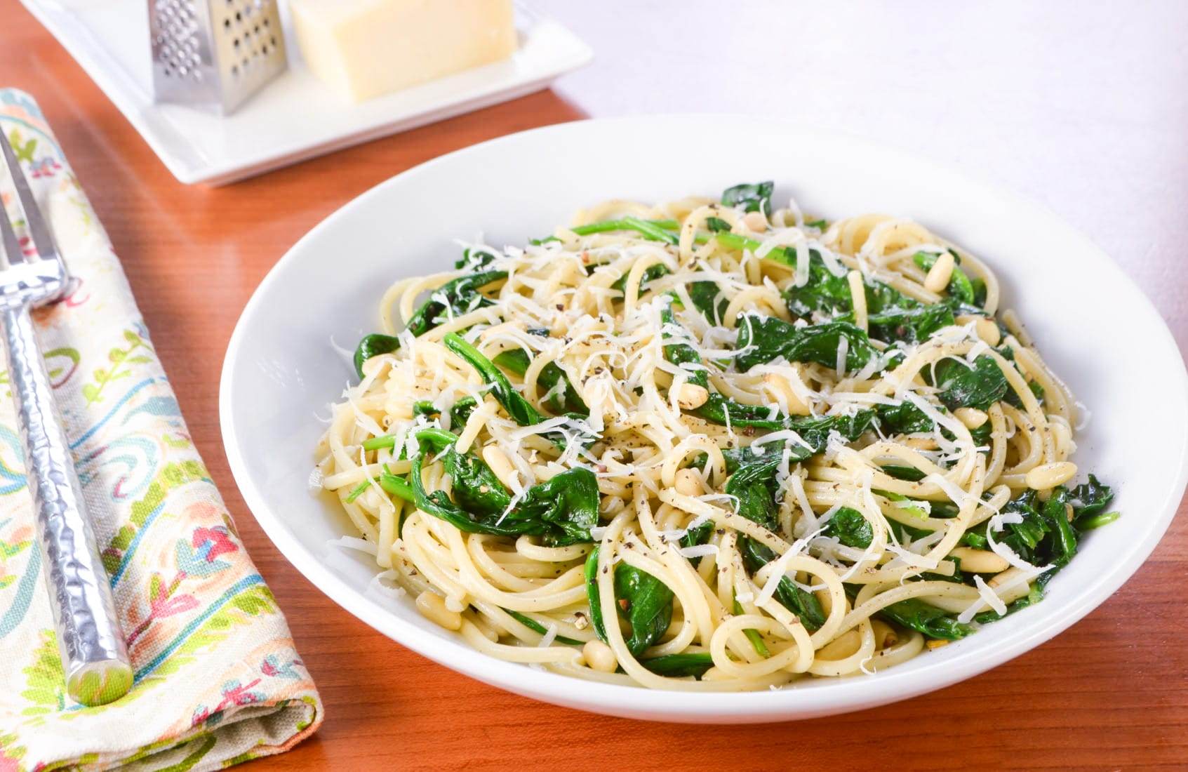 Spaghetti with Garlicky Spinach, Parmesan, and Toasted Pine Nuts