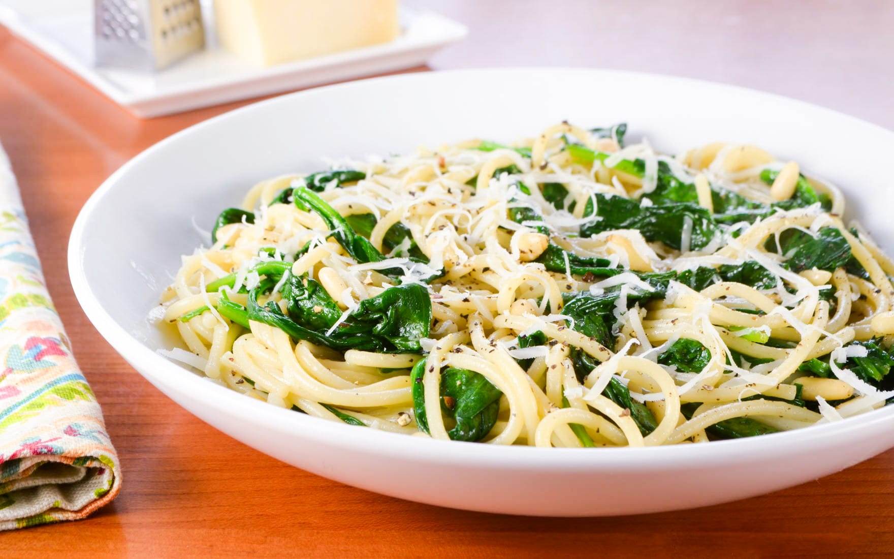 Spaghetti with Garlicky Spinach, Parmesan, and Toasted Pine Nuts