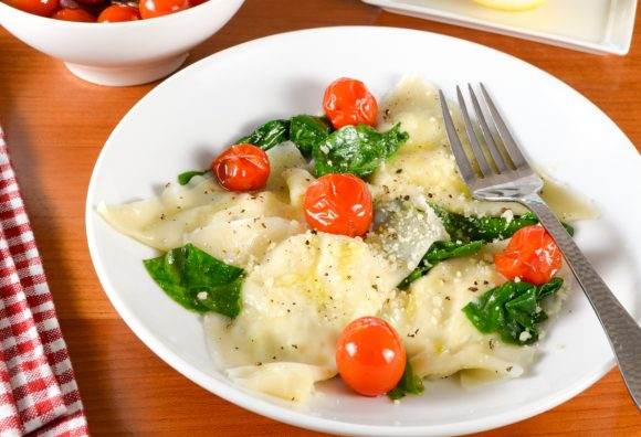 Basil-Ricotta Ravioli with Spinach and Blistered Tomatoes