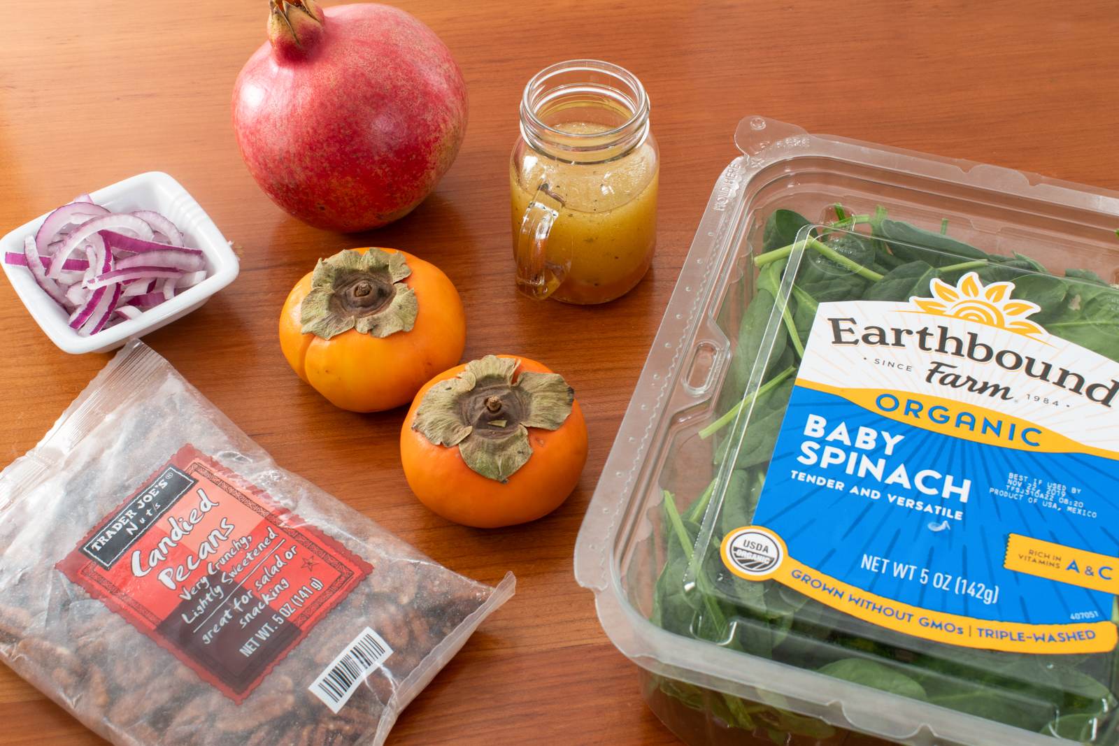 Spinach Salad with Persimmons, Pomegranate Seeds, and Candied Pecans