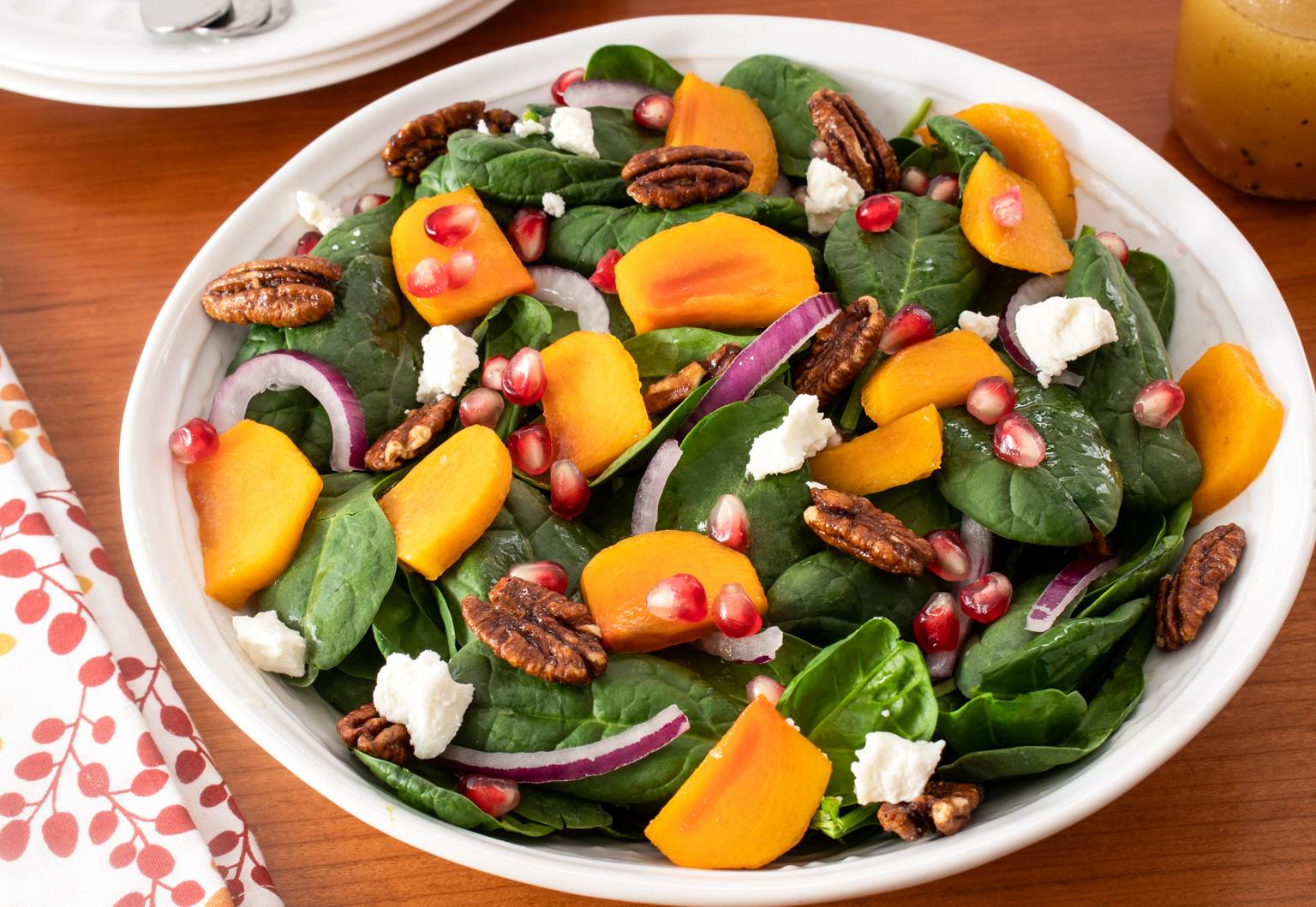 Spinach Salad with Persimmons, Pomegranate Seeds, and Candied Pecans